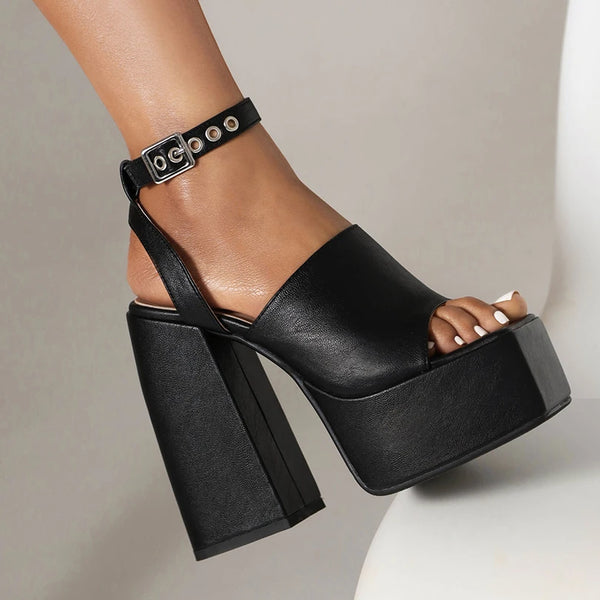 Black platform sandal on a neutral background