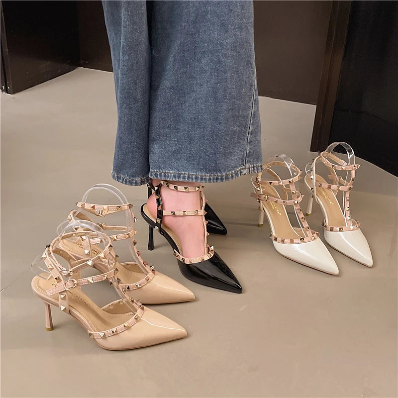 Set of high-heeled shoes with clear straps on a neutral background